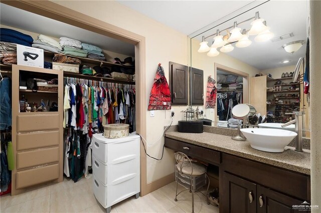 bathroom featuring tile patterned floors and vanity