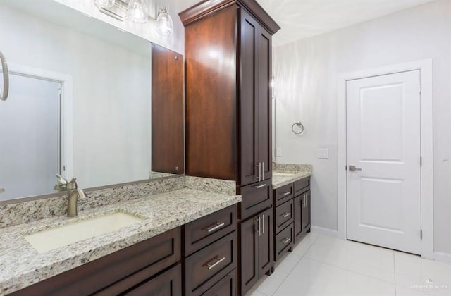 bathroom with vanity and tile patterned floors