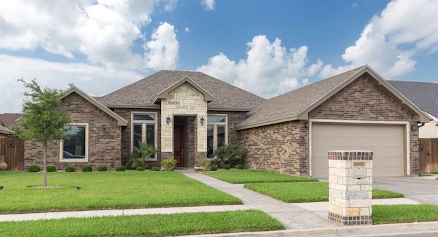 view of front of property with a garage and a front lawn