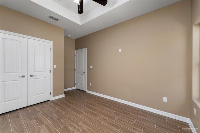 3311 Las Vistas Ln, Weslaco, TX 78596 - unfurnished bedroom featuring baseboards, wood finish floors, a closet, and ceiling fan