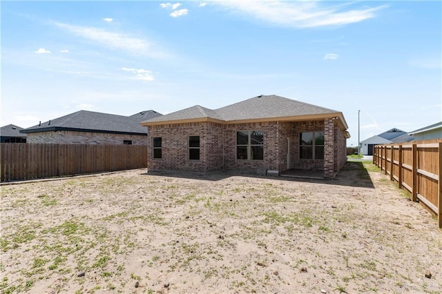 3311 Las Vistas Ln, Weslaco, TX 78596 - back of house featuring brick siding and a fenced backyard