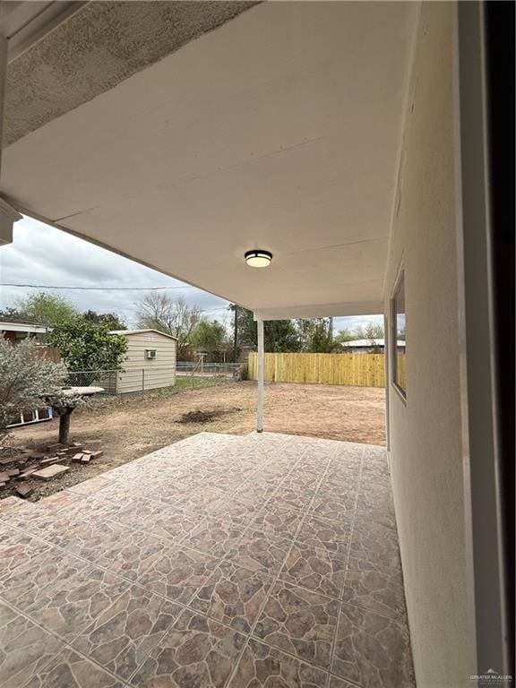 view of patio featuring fence