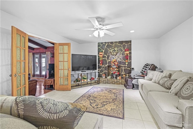 living room with ceiling fan, french doors, light tile patterned floors, and lofted ceiling with beams