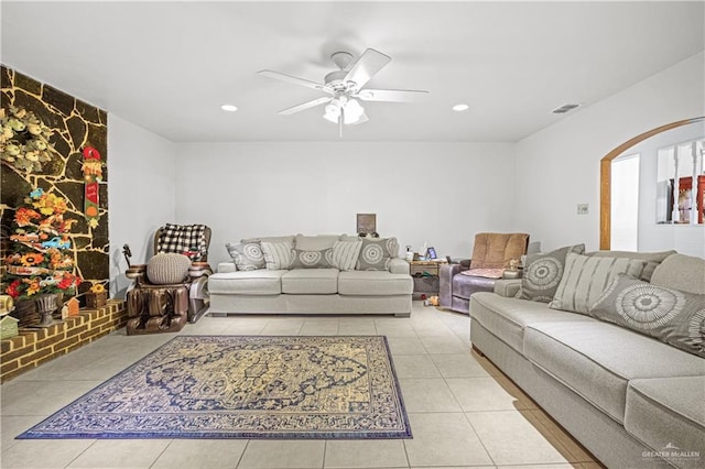 living room with ceiling fan and light tile patterned floors