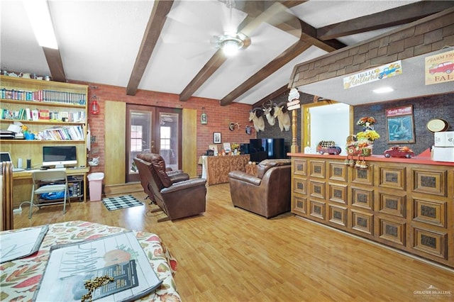 living room with vaulted ceiling with beams, ceiling fan, and hardwood / wood-style flooring