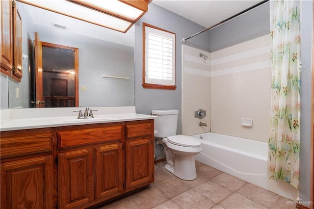 full bathroom featuring shower / bath combo, vanity, a textured ceiling, tile patterned flooring, and toilet