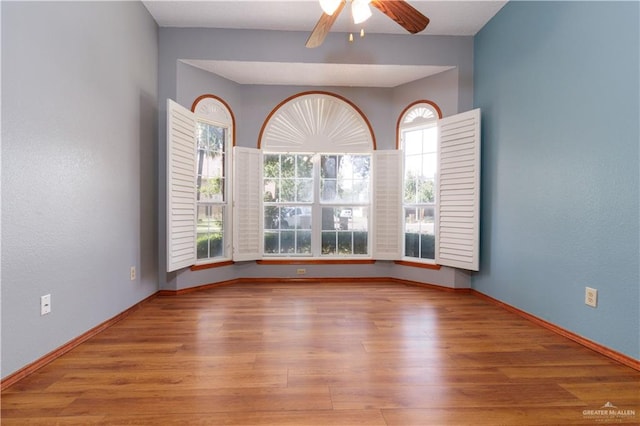 unfurnished room with ceiling fan and light hardwood / wood-style flooring