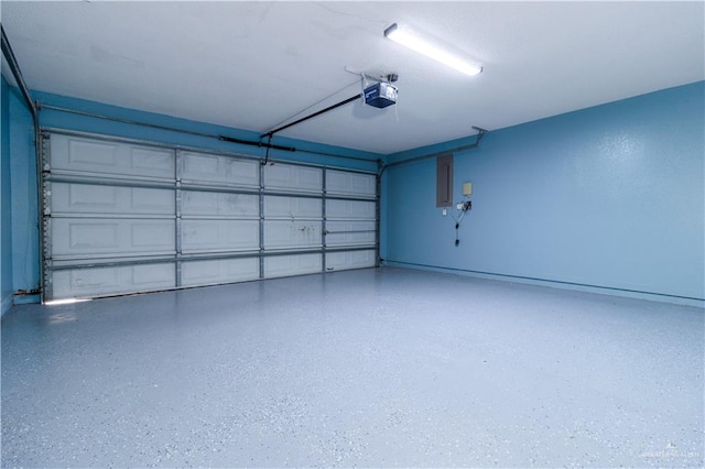 garage featuring electric panel and a garage door opener