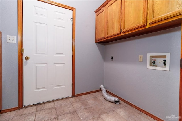 laundry area with washer hookup, electric dryer hookup, and cabinets