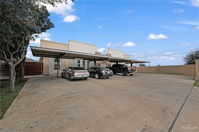 view of vehicle parking with a carport