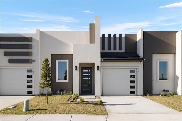 view of front facade with a front yard and a garage