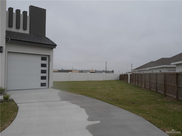 view of yard with a garage