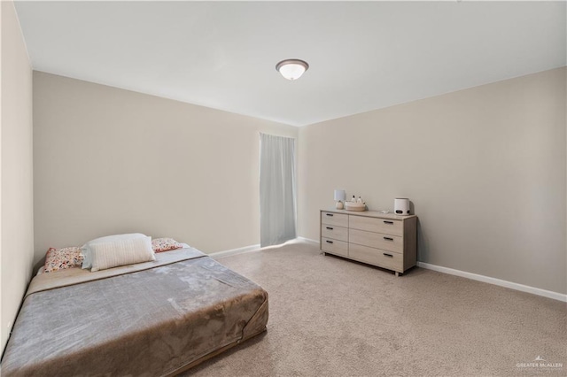 carpeted bedroom with baseboards