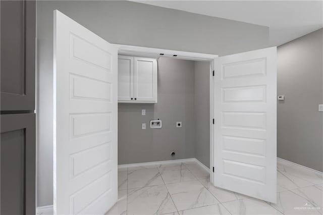 washroom with cabinet space, marble finish floor, hookup for an electric dryer, and hookup for a washing machine