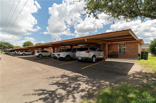 view of vehicle parking with a carport