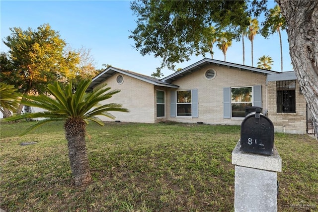 single story home with a front yard