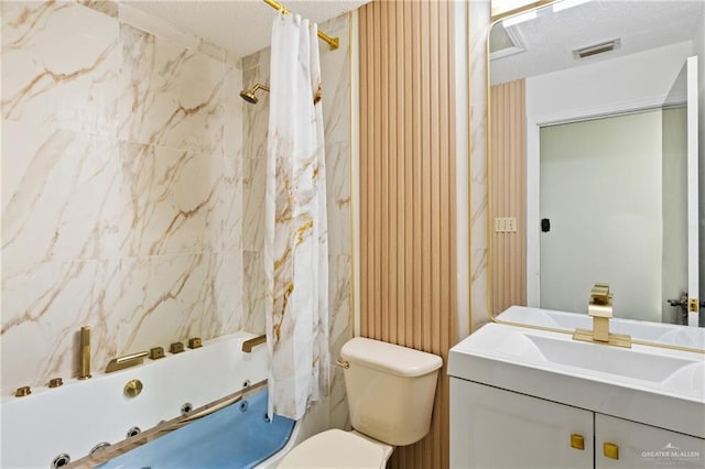 full bathroom featuring shower / tub combo, vanity, a textured ceiling, and toilet