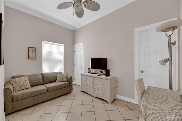 living room with ceiling fan, light tile patterned floors, and crown molding