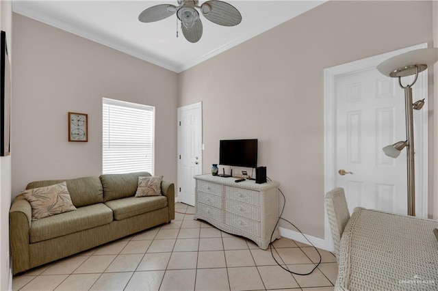 living room with light tile patterned floors, ceiling fan, and ornamental molding