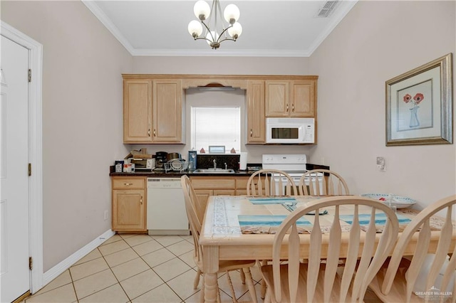 kitchen with pendant lighting, light brown cabinets, white appliances, sink, and a chandelier