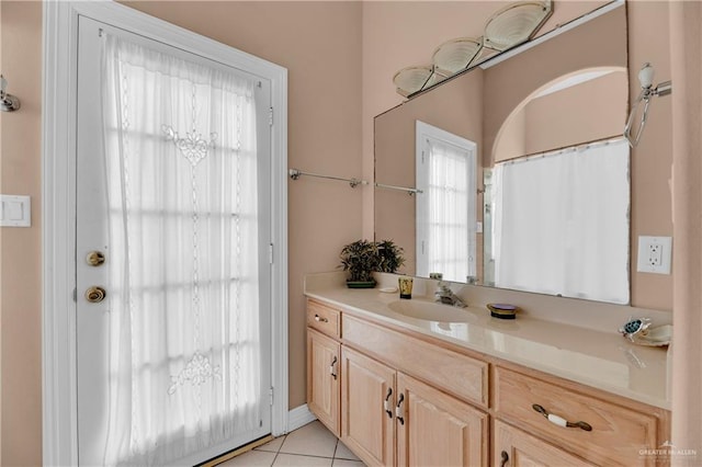 bathroom with tile patterned flooring and vanity