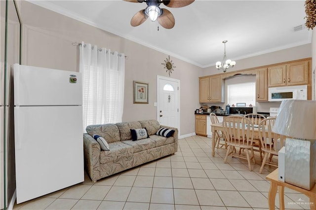 tiled living room featuring ceiling fan with notable chandelier and ornamental molding