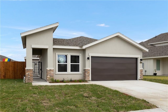 view of front facade with a garage and a front lawn