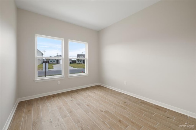 empty room with light hardwood / wood-style floors