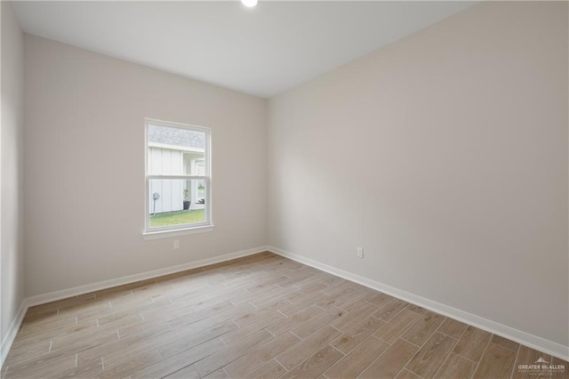 spare room with light wood-type flooring