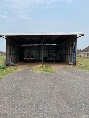 view of vehicle parking featuring a carport