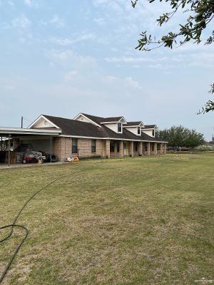 exterior space with a front yard and a carport