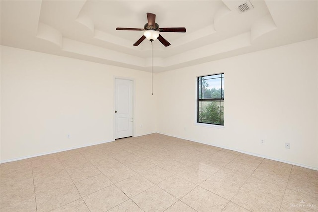 1502 N Popotillo Ave, Edinburg, TX 78541 - spare room featuring light tile patterned floors, ceiling fan, a raised ceiling, baseboards, and visible vents