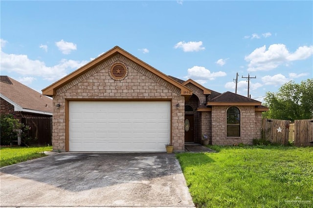 1502 N Popotillo Ave, Edinburg, TX 78541 - ranch-style house with driveway, stone siding, a front yard, and fence