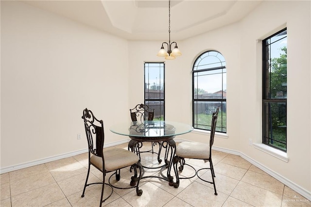1502 N Popotillo Ave, Edinburg, TX 78541 - dining space with light tile patterned flooring, baseboards, a notable chandelier, and a tray ceiling