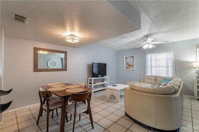 104 E Parade Dr Unit 12, South Padre Island, TX 78597 - living room featuring ceiling fan, light tile patterned floors, and a textured ceiling