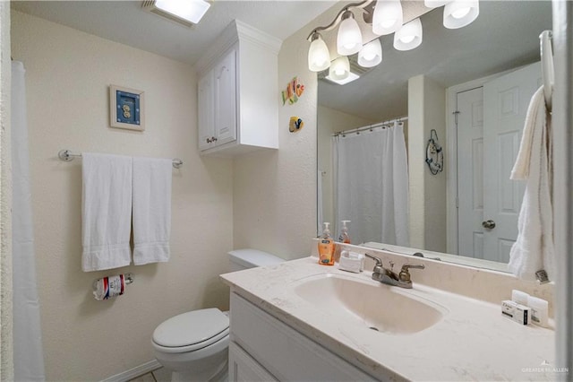 104 E Parade Dr Unit 12, South Padre Island, TX 78597 - bathroom featuring vanity and toilet