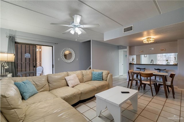 104 E Parade Dr Unit 12, South Padre Island, TX 78597 - tiled living room featuring ceiling fan and sink