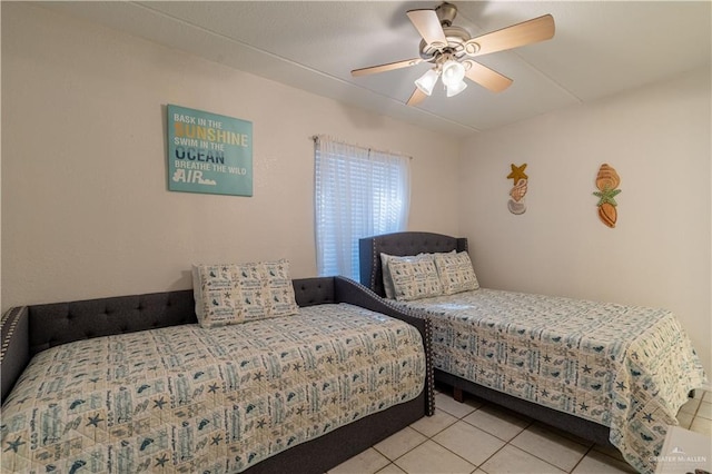 104 E Parade Dr Unit 12, South Padre Island, TX 78597 - bedroom with ceiling fan and light tile patterned floors