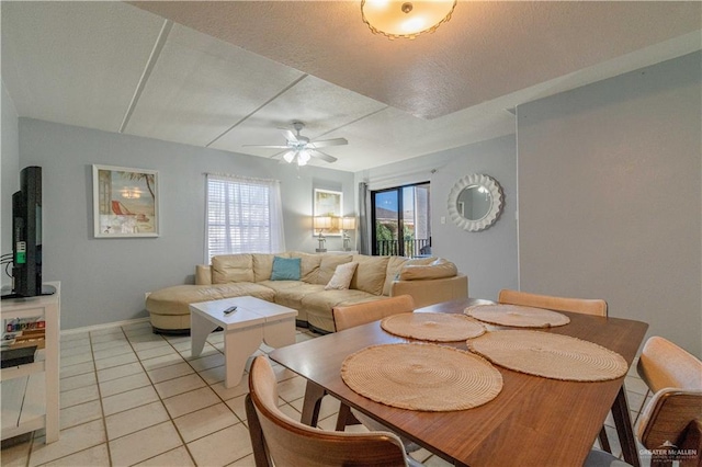 104 E Parade Dr Unit 12, South Padre Island, TX 78597 - dining room with ceiling fan, a textured ceiling, plenty of natural light, and light tile patterned flooring