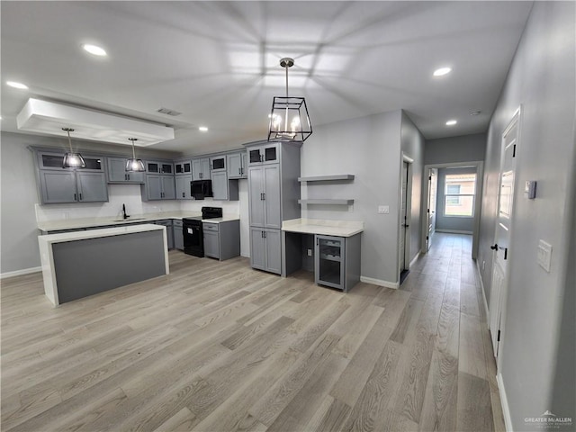 2838 Allen Dr, Edinburg, TX 78539 - kitchen with black appliances, a sink, gray cabinetry, baseboards, and recessed lighting