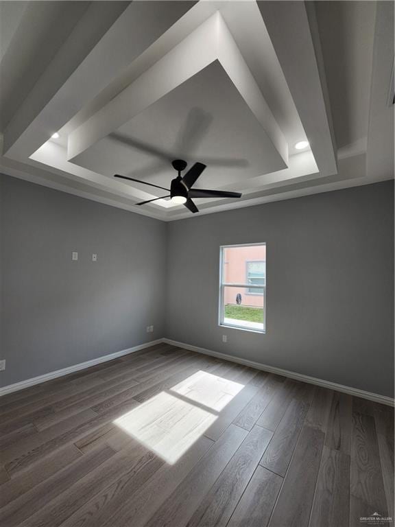 2838 Allen Dr, Edinburg, TX 78539 - unfurnished room featuring a tray ceiling, dark wood finished floors, baseboards, and recessed lighting