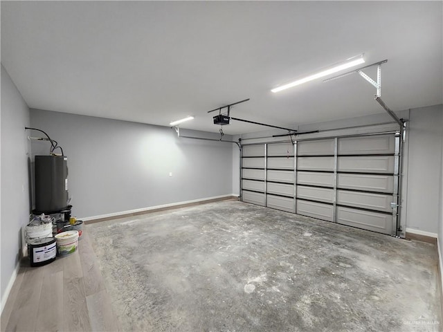 2838 Allen Dr, Edinburg, TX 78539 - garage with water heater, baseboards, and a garage door opener