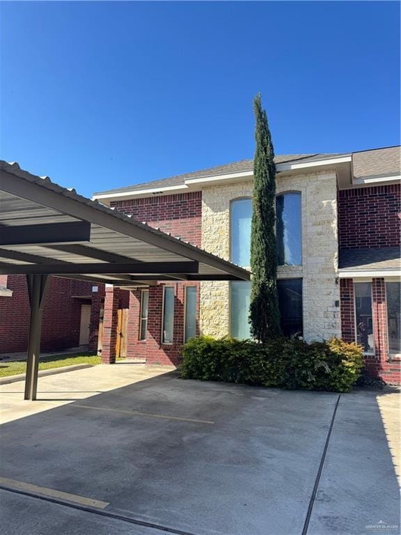 exterior space with a carport