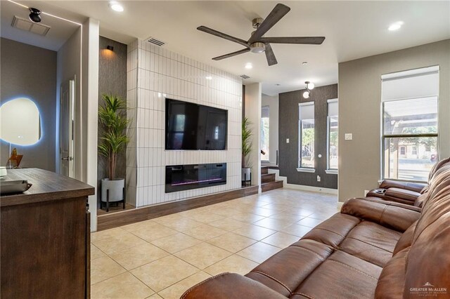 kitchen with sink, light tile patterned floors, a breakfast bar area, white cabinetry, and fridge