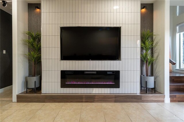 living room with light tile patterned floors and ceiling fan