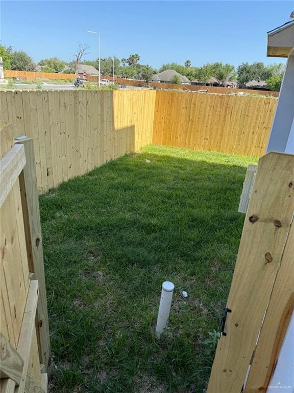 view of yard featuring a fenced backyard