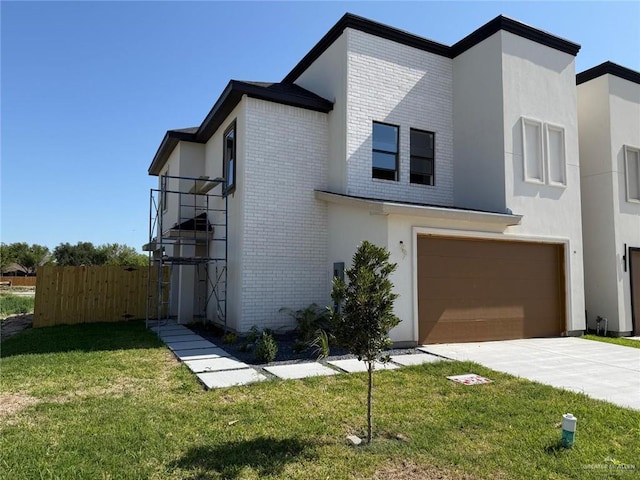 contemporary home with fence, concrete driveway, brick siding, and a garage