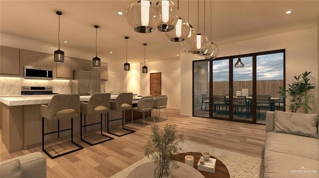 interior space with light wood-style floors and recessed lighting