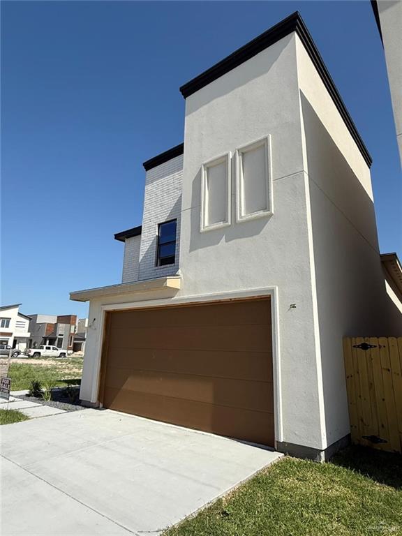contemporary house featuring an attached garage and stucco siding