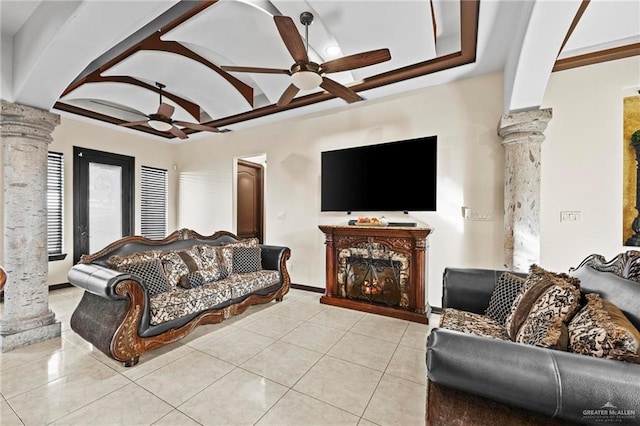 tiled living room featuring ceiling fan and ornate columns